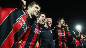 BOURNEMOUTH, ENGLAND - APRIL 27:  (L-R) Brett Pitman, Yann Kermorgant, Eddie Howe manager of Bournemouth, Andrew Surman and Callum Wilson of Bournemouth celebrate victory on the pitch after the Sky Bet Championship match between AFC Bournemouth and Bolton Wanderers at Goldsands Stadium on April 27, 2015 in Bournemouth, England. Bournemouth's 3-0 victory puts them on the brink of promotion to the Barclays Premier League.  (Photo by Clive Rose/Getty Images)
